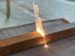 Laser cleaning surface preparation on a metal beam